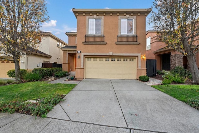 view of front of house featuring a garage and a front lawn