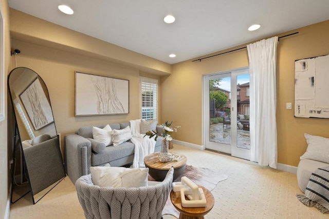 interior space with plenty of natural light and light carpet