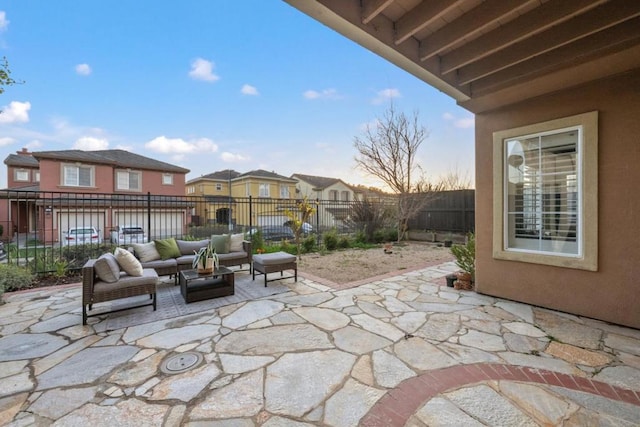 patio terrace at dusk featuring outdoor lounge area