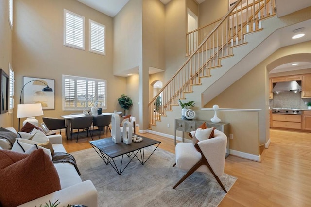 living room with a wealth of natural light and light hardwood / wood-style floors