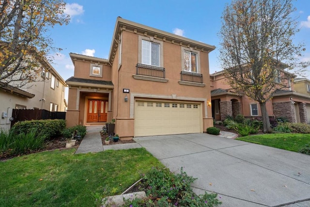 view of front of home featuring a garage and a front lawn