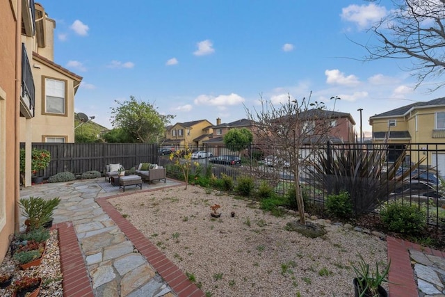 view of yard with outdoor lounge area and a patio area