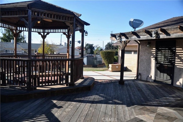 wooden terrace with a pergola and a gazebo