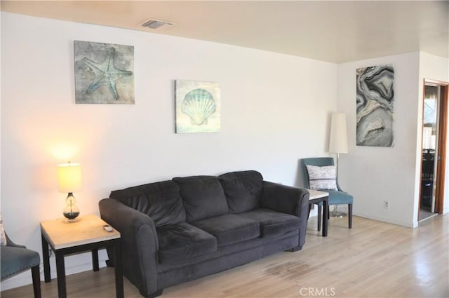 living room with light hardwood / wood-style floors