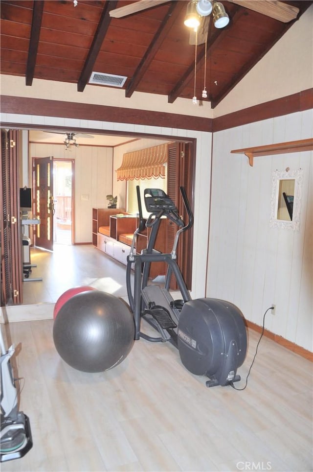 workout room with wood ceiling, ceiling fan, lofted ceiling, and light wood-type flooring