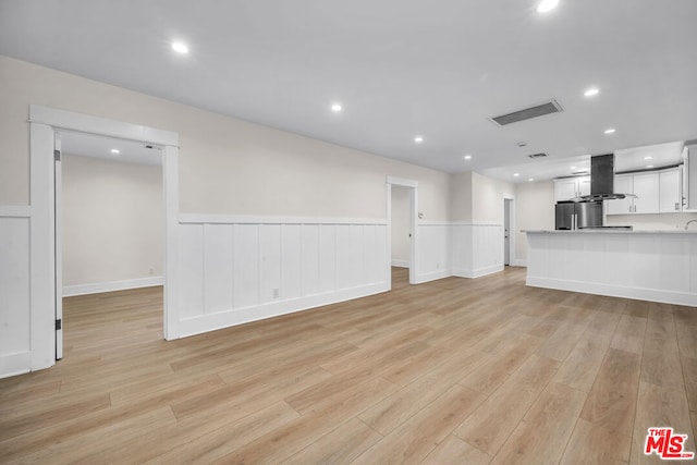 unfurnished living room with light wood-type flooring