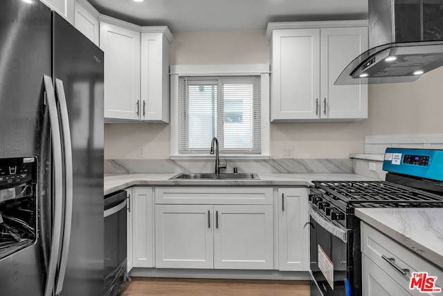 kitchen featuring extractor fan, white cabinetry, sink, black appliances, and light stone countertops