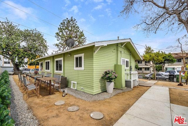 view of side of property with central AC