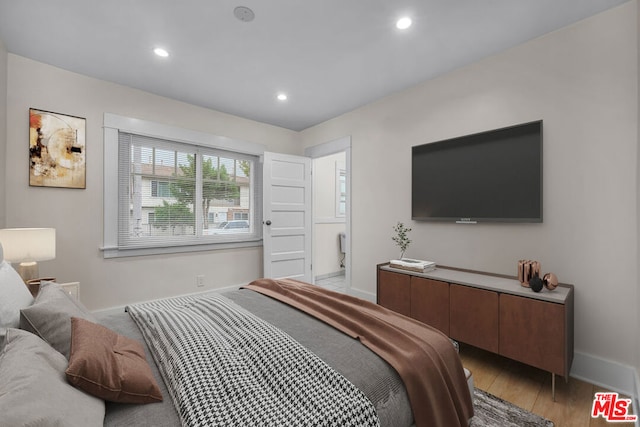 bedroom with light hardwood / wood-style floors