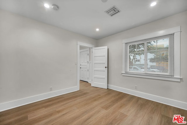 unfurnished bedroom with light hardwood / wood-style flooring