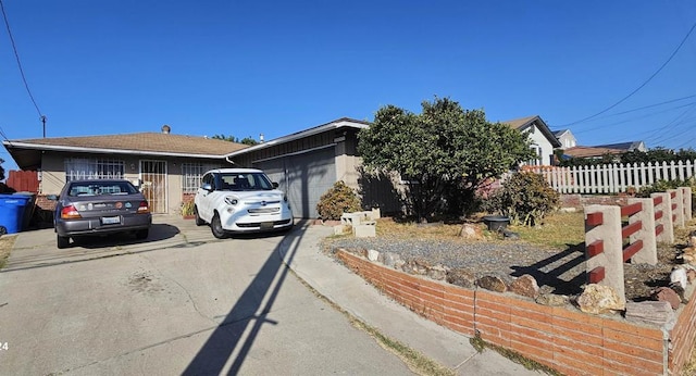 ranch-style house featuring a garage