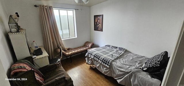 bedroom featuring dark hardwood / wood-style flooring