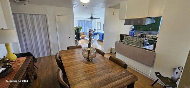 dining room featuring ceiling fan and hardwood / wood-style floors