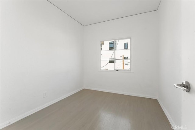 empty room with hardwood / wood-style floors