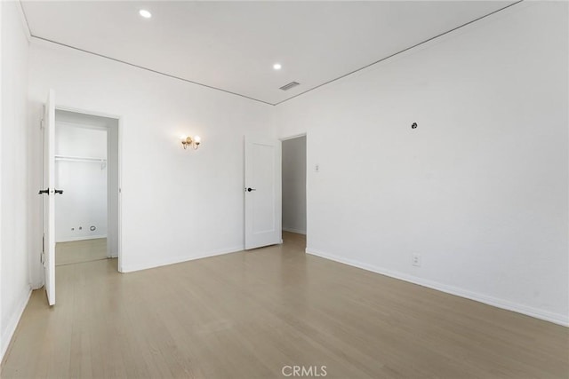 unfurnished room featuring light hardwood / wood-style floors