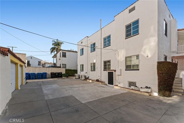 back of property featuring a garage