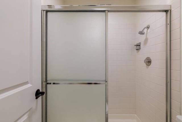 bathroom featuring an enclosed shower