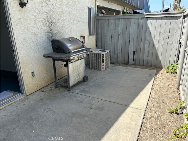 view of patio with grilling area and central AC unit