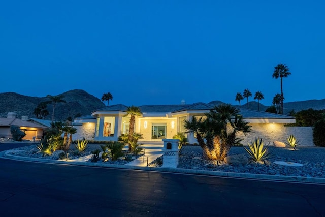 view of front of property with a mountain view