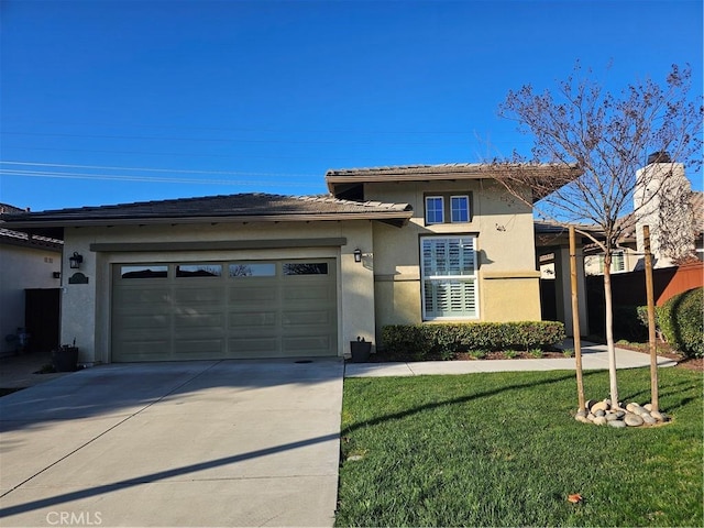 view of front of property featuring a garage and a front yard