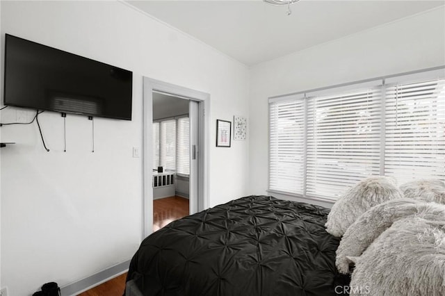 bedroom with hardwood / wood-style flooring