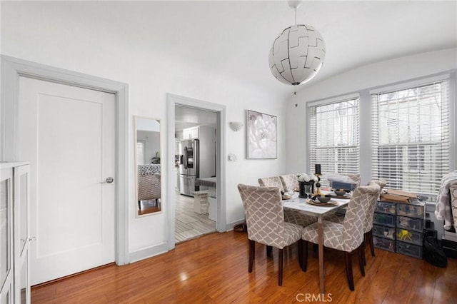 dining room featuring a chandelier and hardwood / wood-style floors