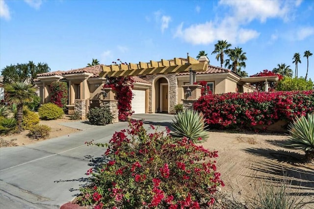 mediterranean / spanish-style home featuring a garage