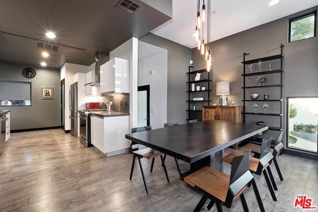 dining room featuring light hardwood / wood-style flooring