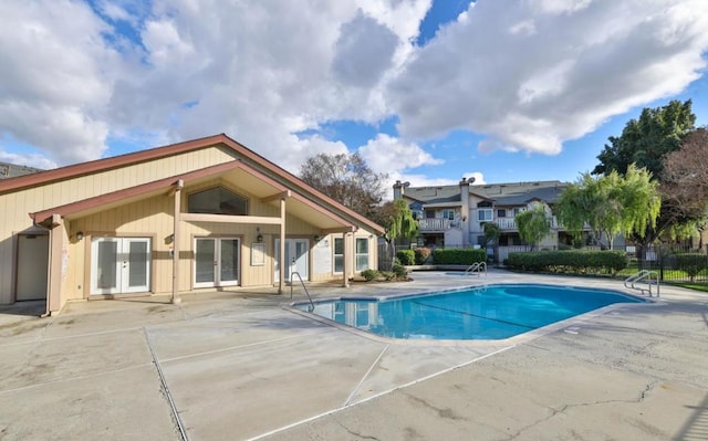 view of swimming pool with a patio area