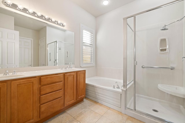 bathroom with vanity, independent shower and bath, and tile patterned flooring