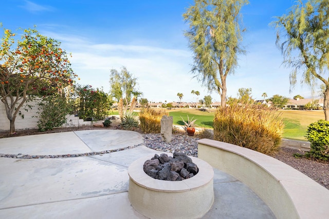 view of patio / terrace featuring a fire pit