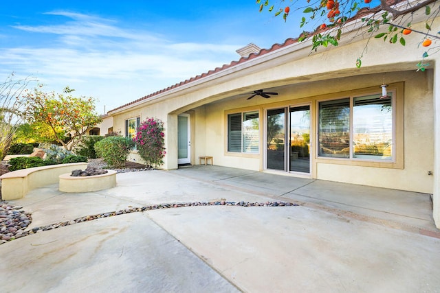 view of patio featuring ceiling fan