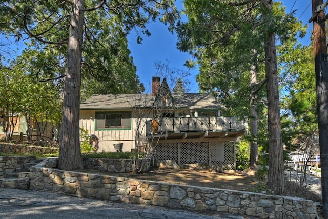 view of front of home featuring a wooden deck