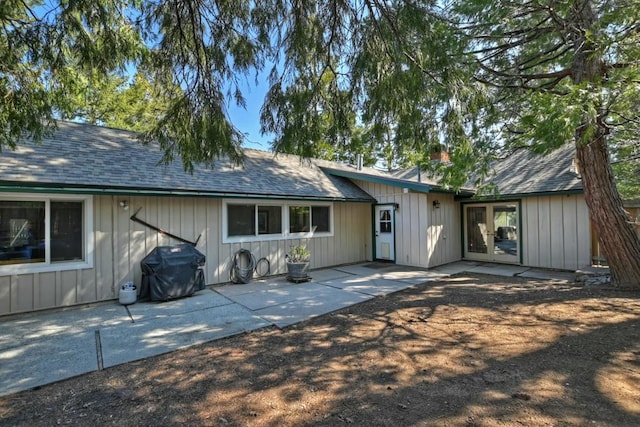 rear view of property featuring a patio