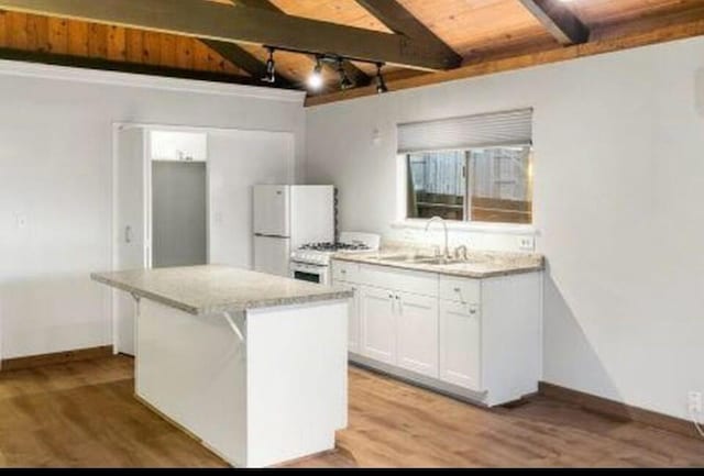 kitchen featuring a kitchen island, white cabinetry, sink, wood ceiling, and white appliances