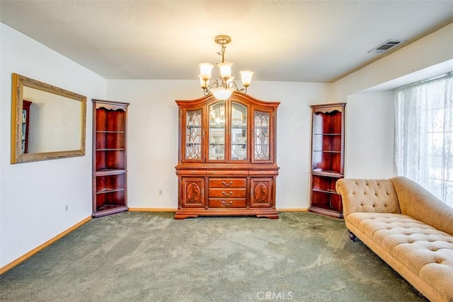 unfurnished room featuring carpet floors and a chandelier