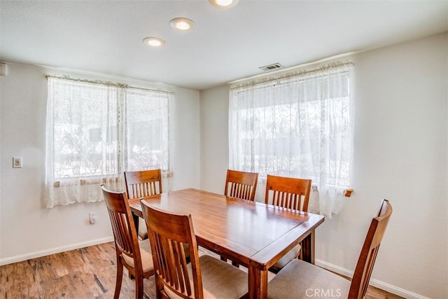 dining area featuring light wood-type flooring