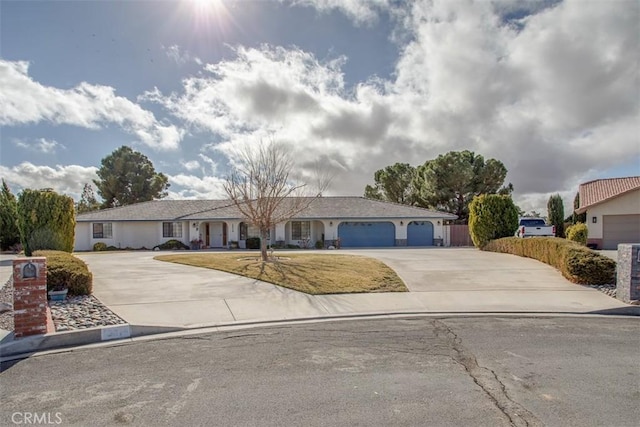 ranch-style house with a garage and a front lawn