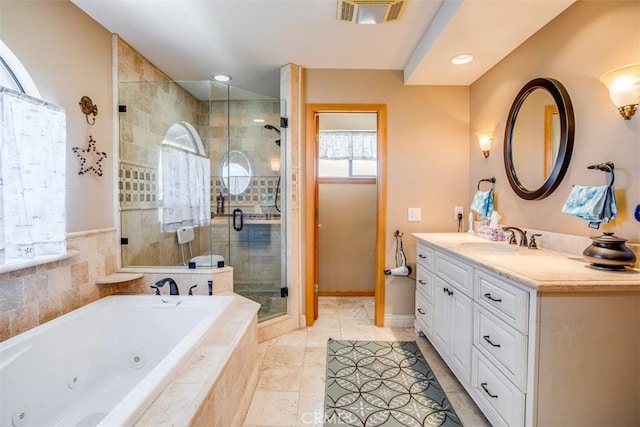 bathroom featuring vanity, plus walk in shower, and tile patterned flooring