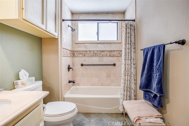 full bathroom featuring vanity, shower / tub combo with curtain, tile patterned floors, and toilet