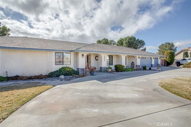 ranch-style home featuring a garage