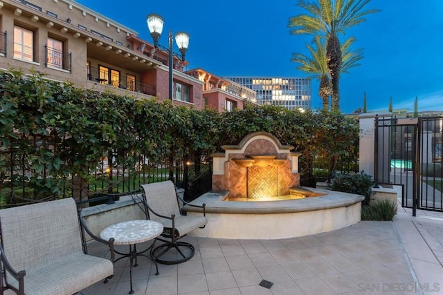 view of patio terrace at dusk