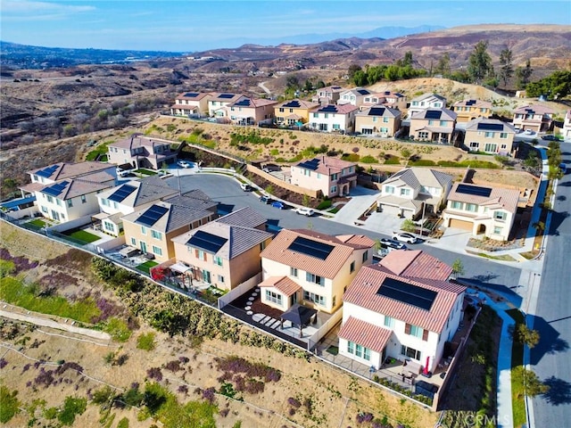 drone / aerial view featuring a mountain view