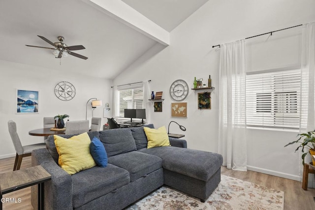 living room with hardwood / wood-style flooring, vaulted ceiling with beams, and ceiling fan