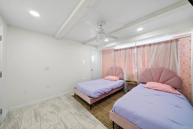 bedroom featuring beamed ceiling and ceiling fan