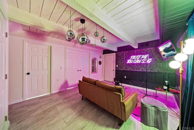 home theater room featuring wooden ceiling and beamed ceiling