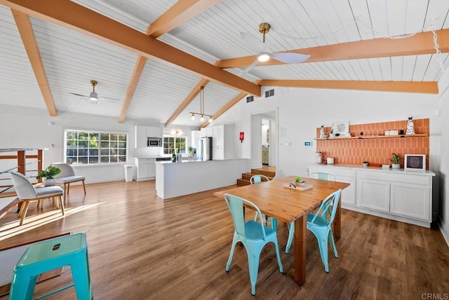 dining room featuring vaulted ceiling with beams, wood ceiling, light hardwood / wood-style flooring, and ceiling fan