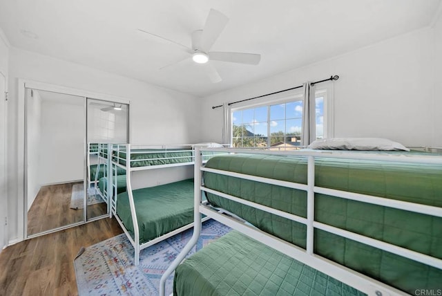 bedroom featuring hardwood / wood-style flooring and ceiling fan