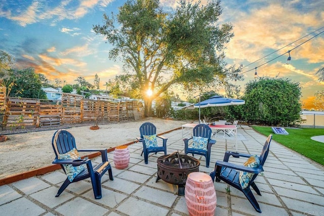 patio terrace at dusk with a fire pit