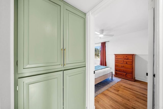 bedroom with ceiling fan and light wood-type flooring